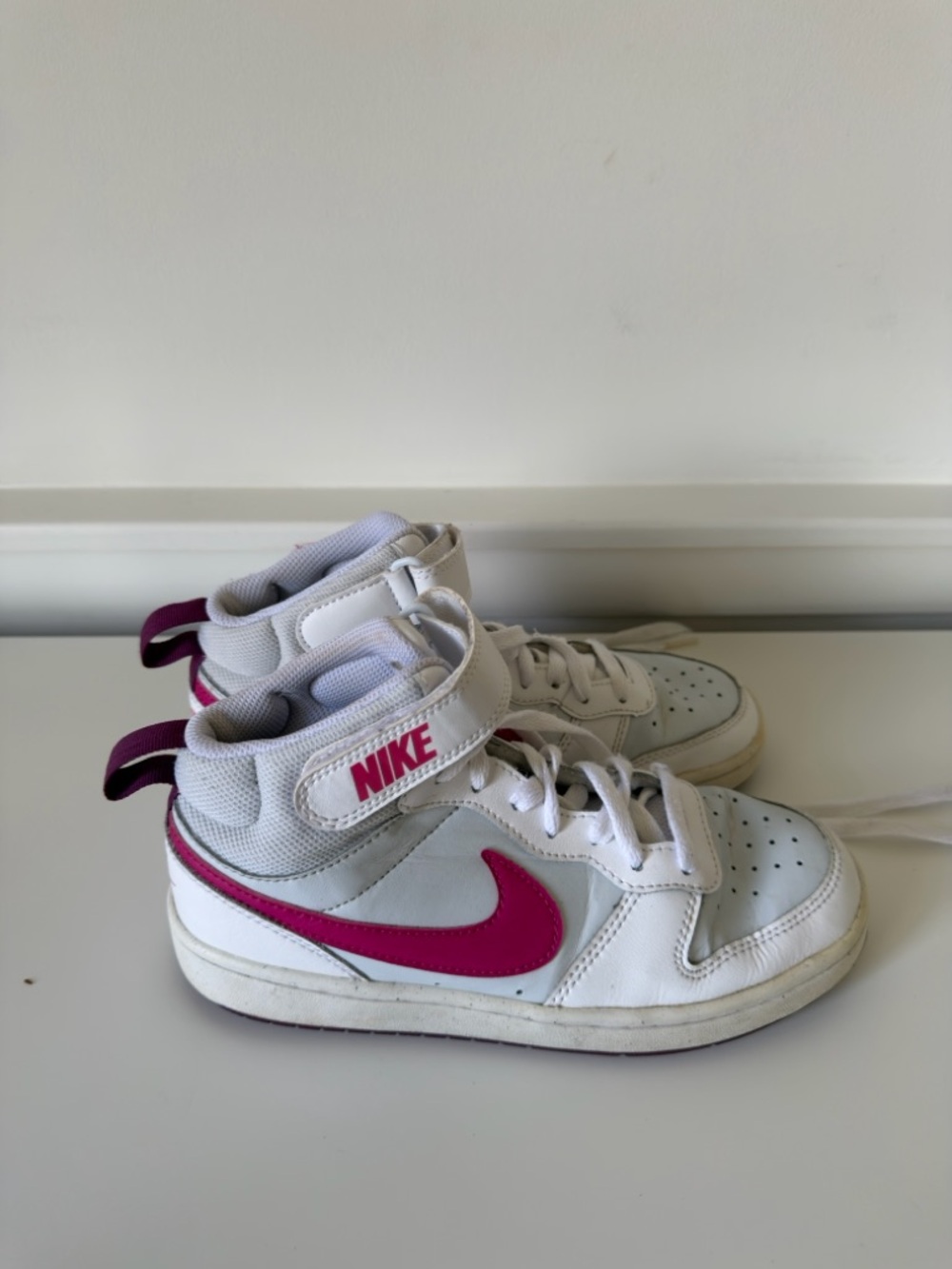 Nike Kids White Sneakers with Pink Swoosh High-Tops